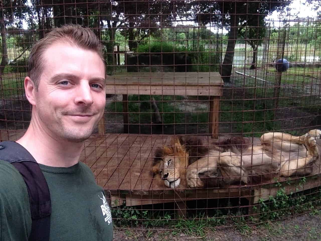 Chris with Joesph a male lion - Big Cat Rescue