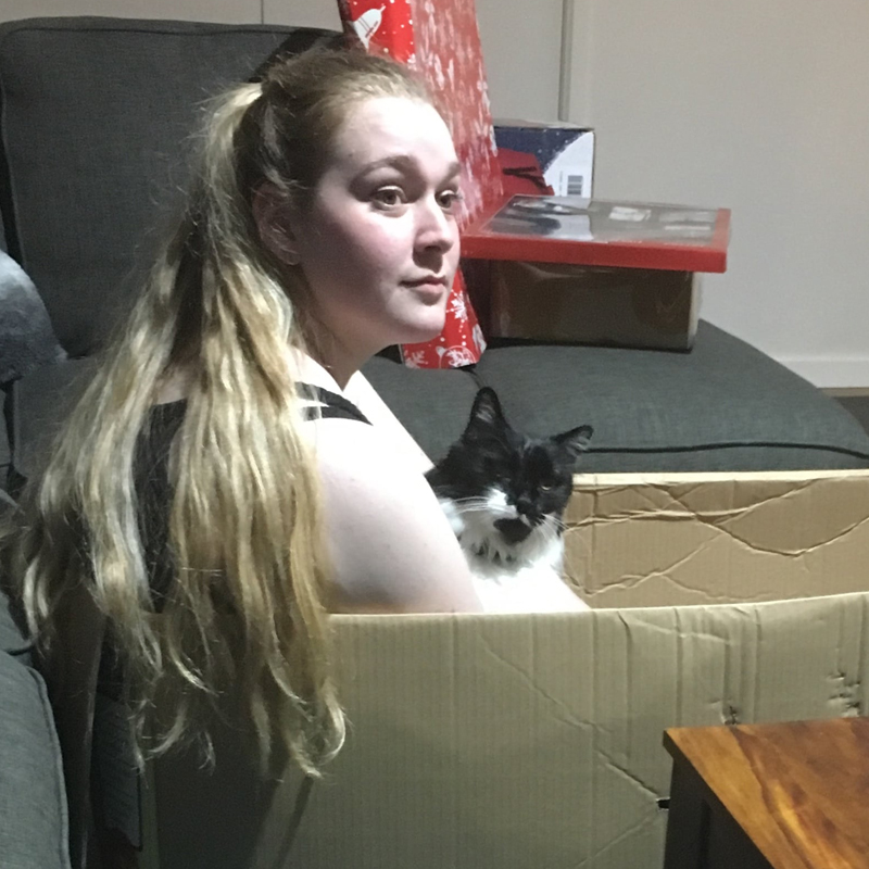 Girl with cat in box