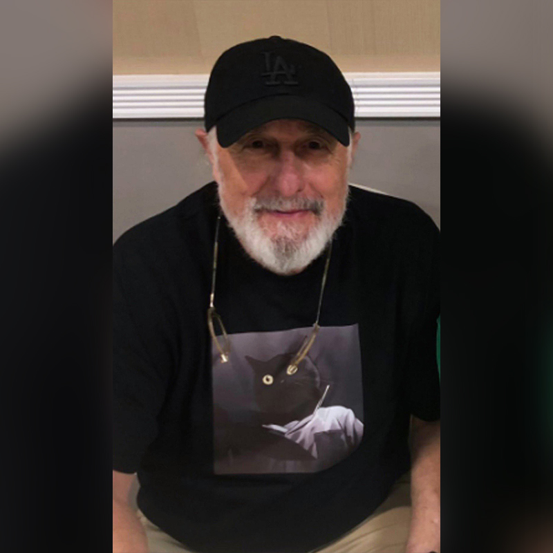 Nick Castle wearing T-shirt with cat 