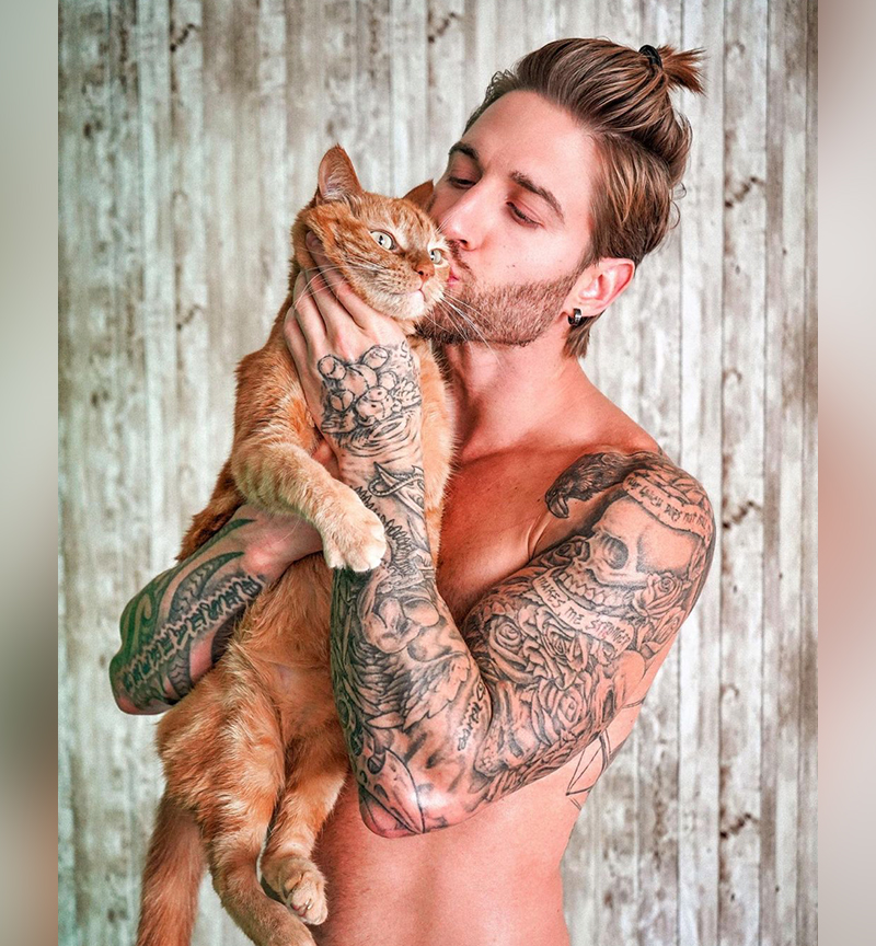 Model and cat hugging