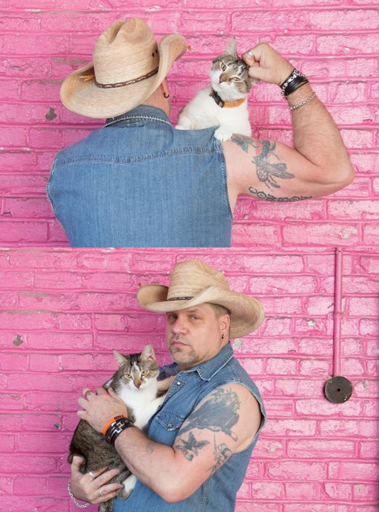 Bob with cat against pink wall