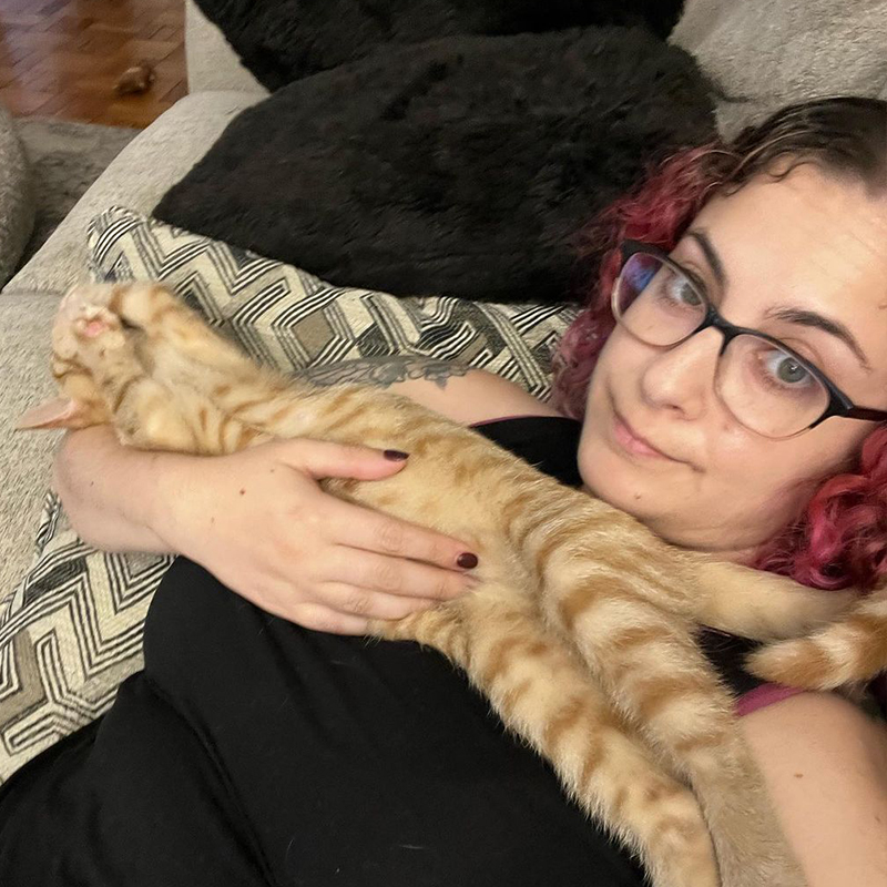 Marshall all grown up in forever home cuddles with mama