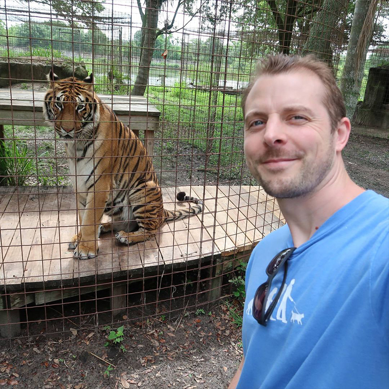 Cat Man Chris with Hoover, the tiger at Big Cat Rescue in 2018.