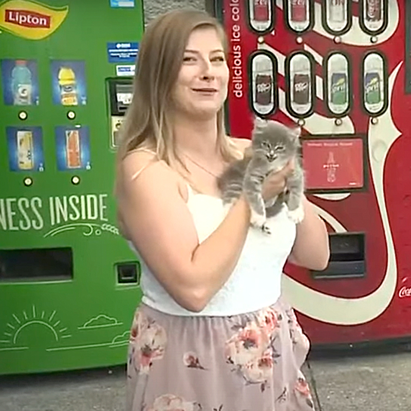 Lindsey Russell from Morristown, Tennessee with kitten dubbed Pepsi in front of Walmart