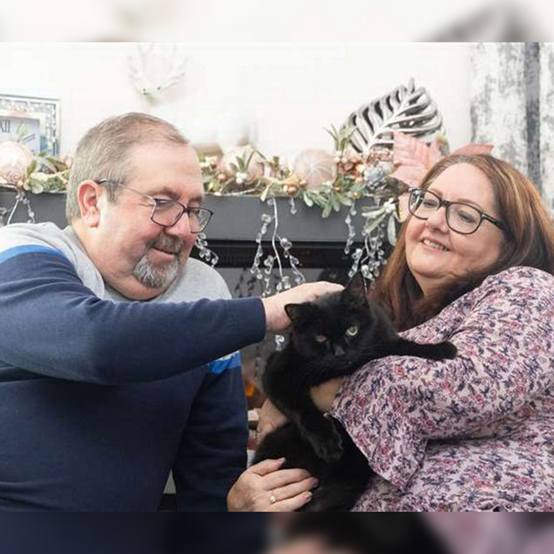 Deb and Tony Pearce with black cat, Billy, 2