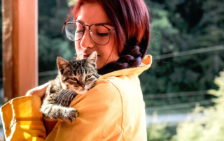 Woman holding cat, woman and adopted cat Benji, reincarnated spirit of her dad, Reddit