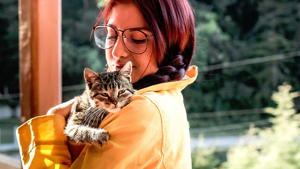 Woman holding cat, woman and adopted cat Benji, reincarnated spirit of her dad, Reddit