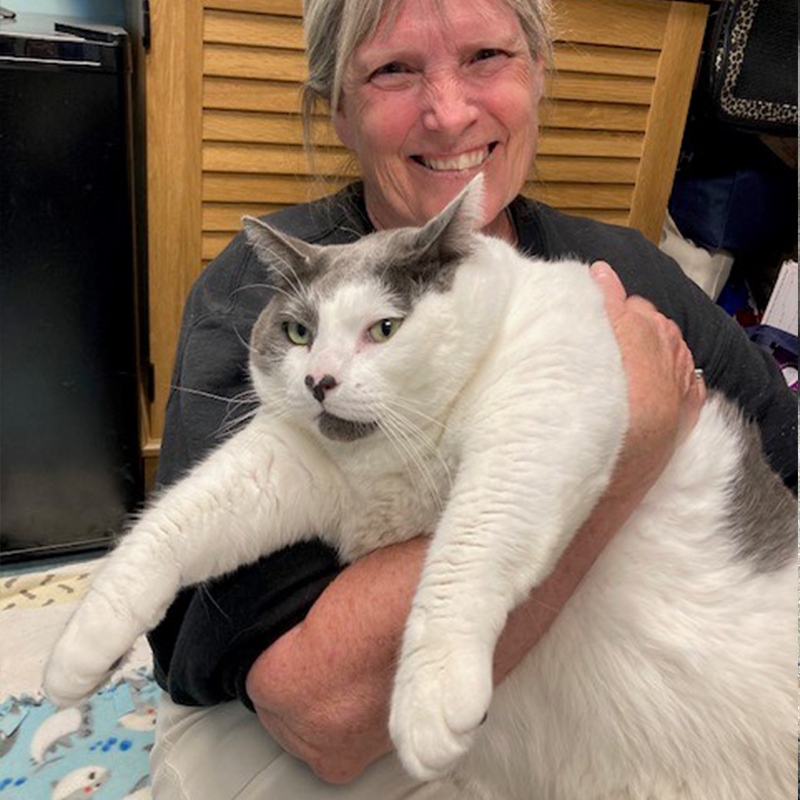 Kay Ford holding Patches after adopting him.