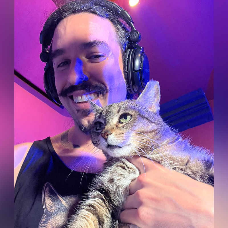 Anthony Vincent holds Pyretta the cat, metal music