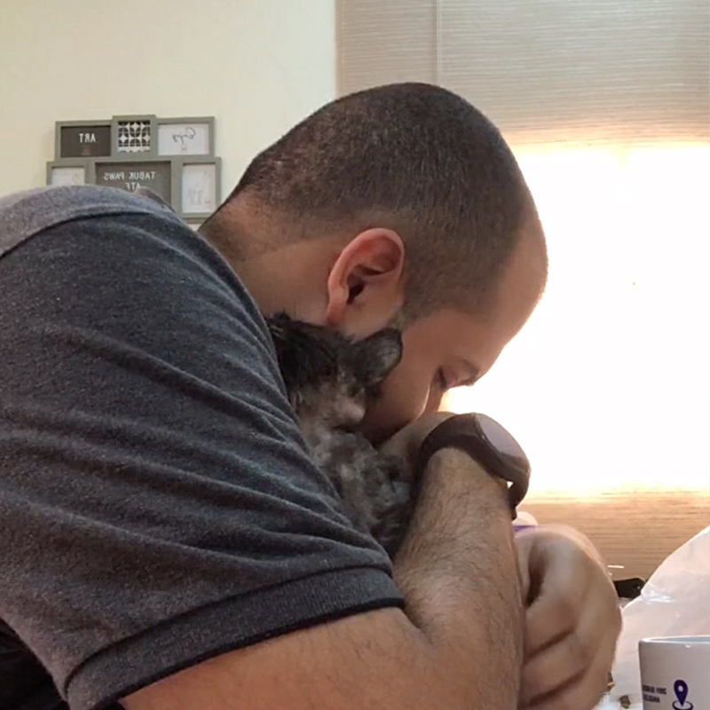 Mohamed embraces the cute kitten
