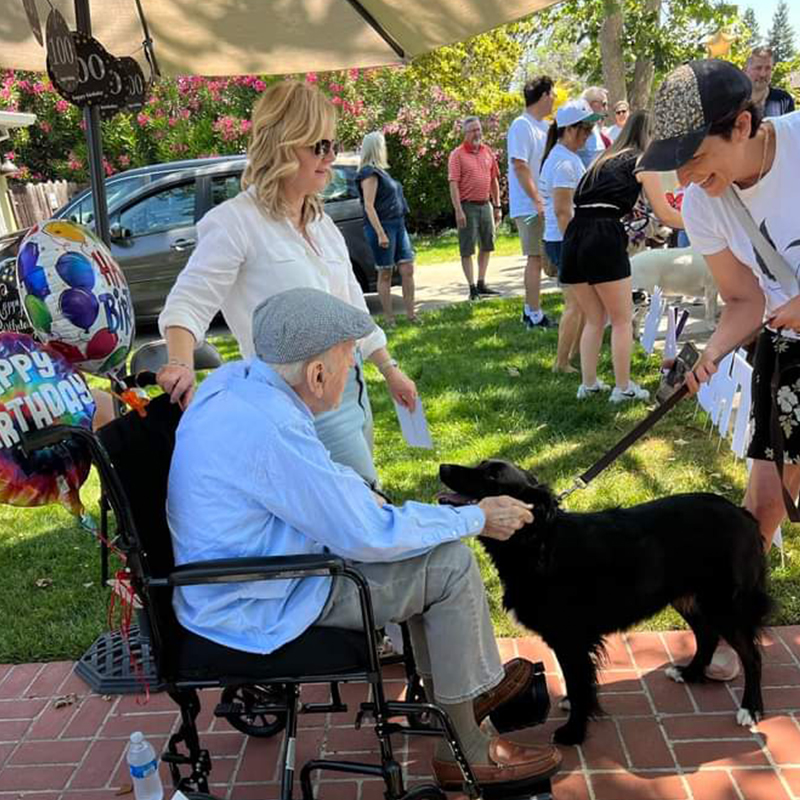 100th birthday, centenarian, Dr. Moore and his daughter greet visitors at the dog parade