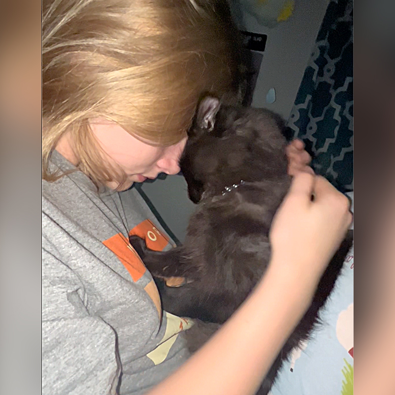 Ava cuddles with her rescued kitty Amorè, Alabama, Lori King