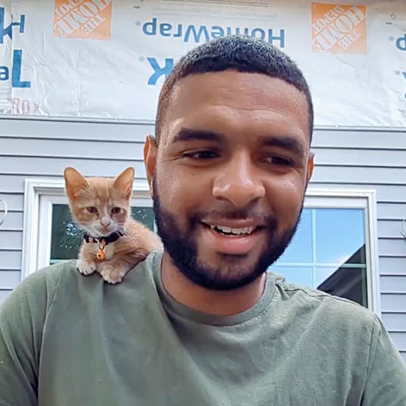 Kyle Norton with the cute kitten Lilo saved from a barrel at the construction site