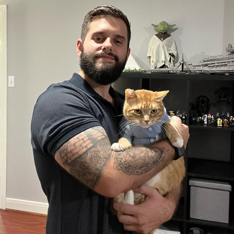 Andrew Villarreal with Sebby. Men adopted cats